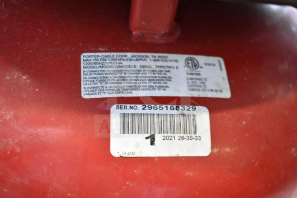 Porter & Cable C2002 air compressor, 120 volts, 1 phase. Serial number 2965168329. Visible model and safety labels.