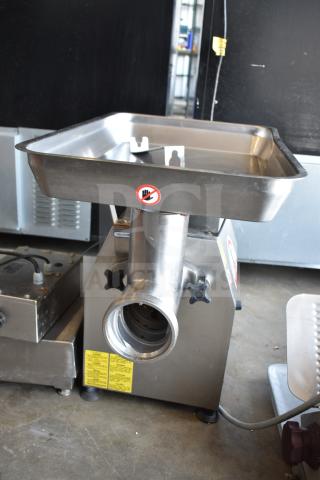 Minerva Omega A/32 commercial countertop meat grinder, 220 volts, 1 phase, stainless steel, with safety and instruction labels.
