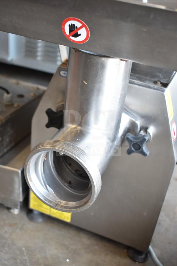 Minerva Omega A/32 Commercial Meat Grinder, 220V, 1 Phase. Stainless steel, robust build with visible safety label.