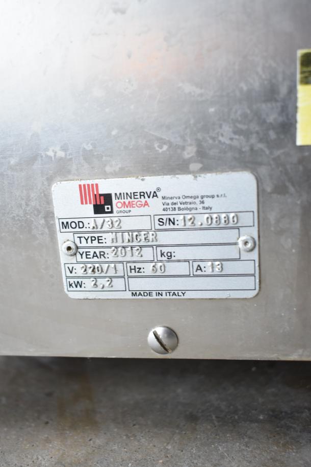 Minerva Omega A/32 commercial meat grinder, 220V, 1 phase. Made in Italy, model details visible on label.