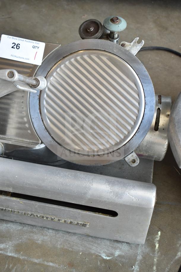 Globe 685 commercial countertop meat slicer with blade sharpener, 115V, shows moderate wear, auction tag visible.