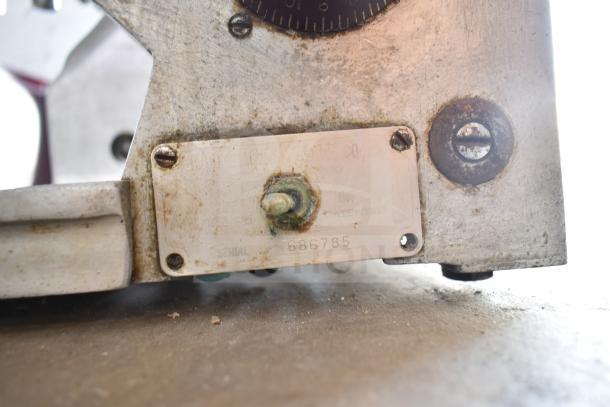 Globe 685 Commercial Meat Slicer, countertop model with blade sharpener. Visible label shows serial number 686785. Used condition.