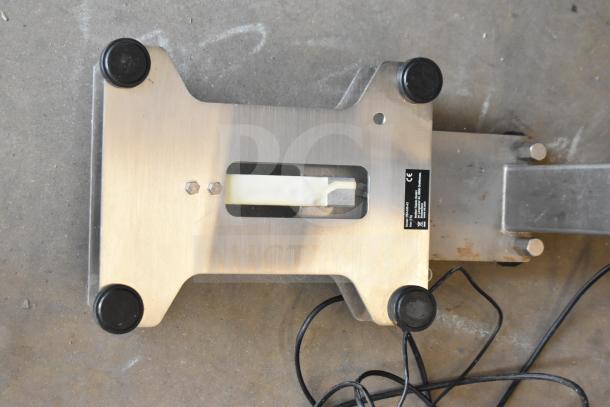 Mettler Toledo PBA436-A3 commercial scale, metal base, visible cable, protective pads, manufacturer's label on side.