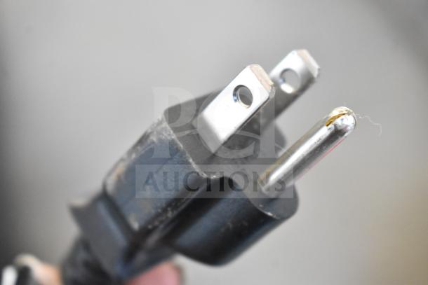 Power plug of the Mettler Toledo PBA436-A3 Commercial Scale, showing standard three-prong design.