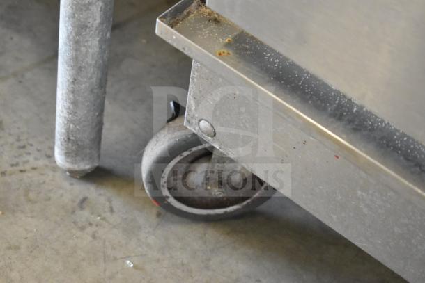 Winston CVap CA8522GR Commercial Cook N Hold Oven caster detail, showing wear and metal frame condition.
