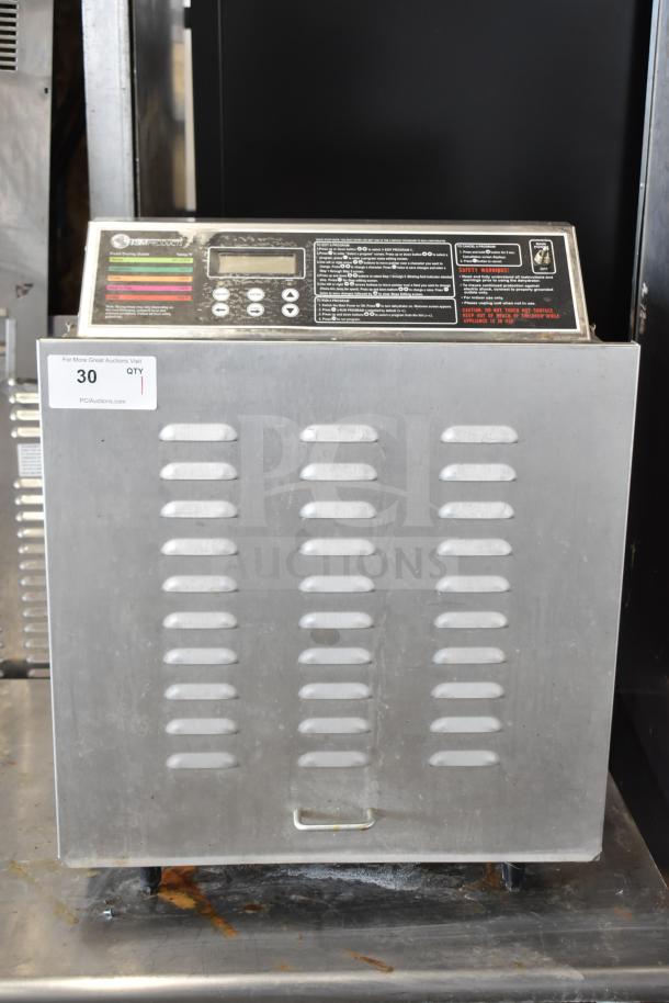 TSM Products Commercial Countertop Dehydrator, brushed metal finish, digital controls, used condition, item tag visible.