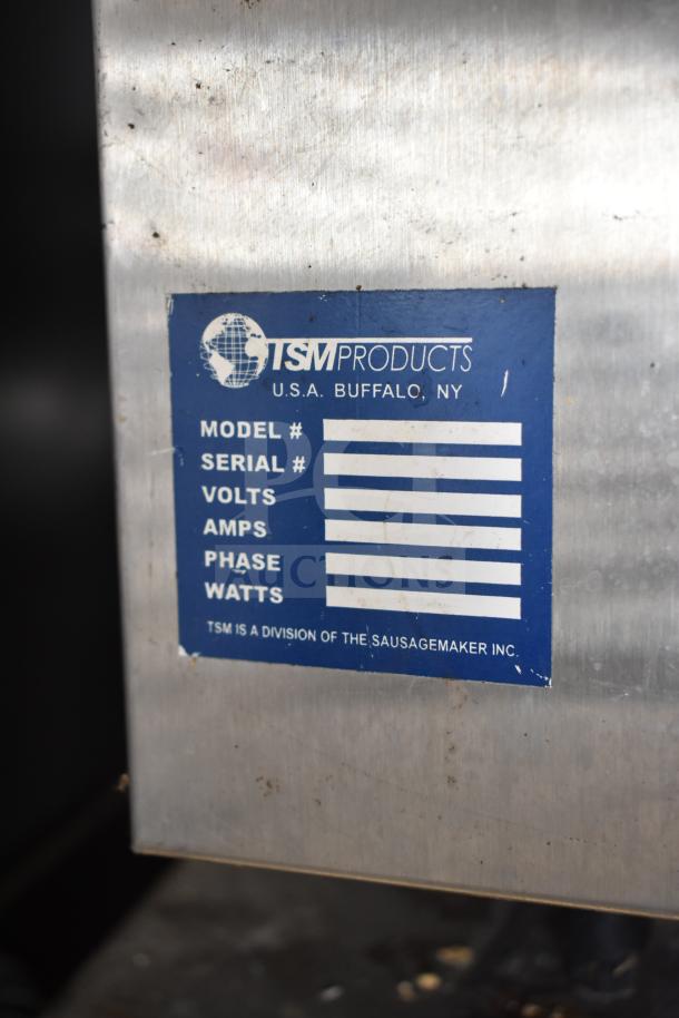 TSM Products Commercial Countertop Dehydrator with blue label for model, serial, power specs; stainless steel body.