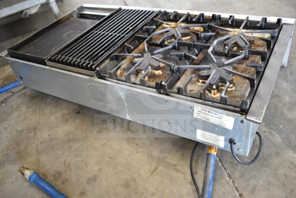 Thermador commercial countertop 4-burner gas range with charbroiler and flat top griddle. Used condition with visible wear.