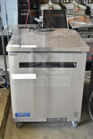 Arctic Air AUC27FZ commercial single-door undercounter freezer on casters, stainless steel, 115 volts, good condition.