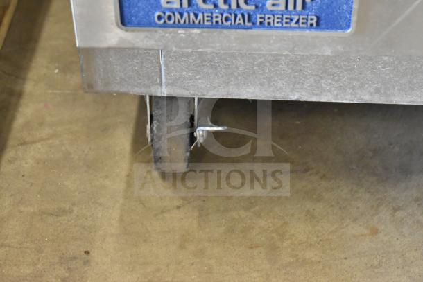 Arctic Air AUC27FZ freezer on caster, stainless steel, 115V, single door, commercial use, shows commercial label.