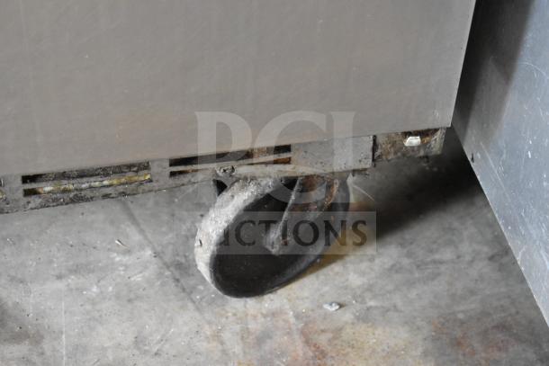 Beverage Air WTR72AY commercial cooler caster, showing wear and rust, undercounter unit, 115V, 1 Phase.