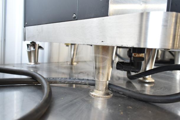 Clover 1S countertop premium automated single-cup coffee brewer, 200-240 volts, showing base and electrical connections.