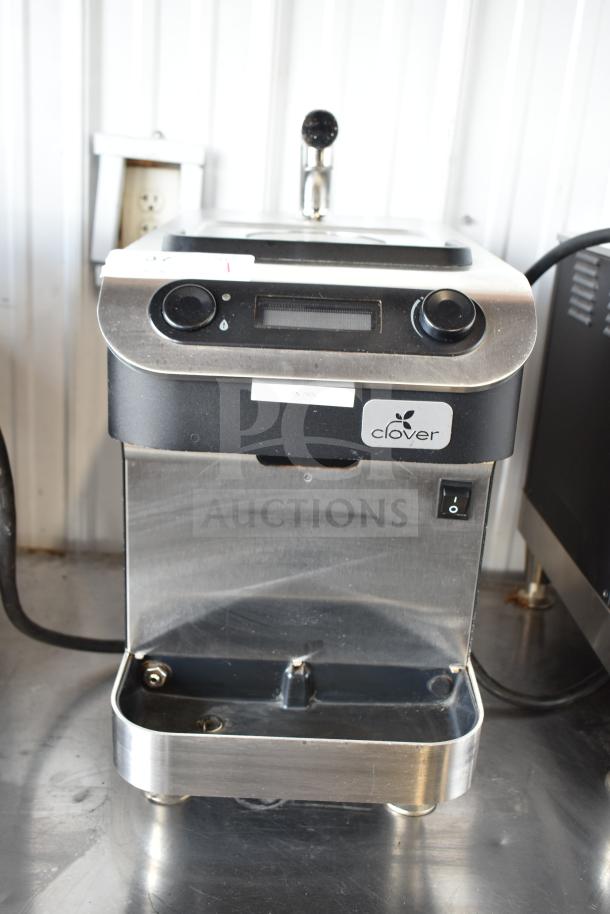 Clover 1S countertop single-cup coffee brewer, stainless steel, automated, 200-240 volts, visible logo and controls.