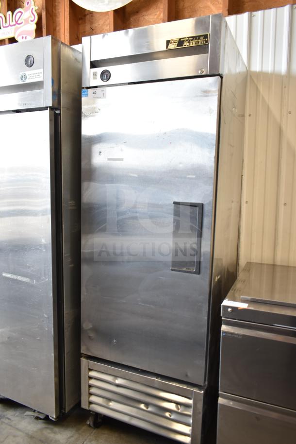 True T-23F commercial single door reach-in freezer on casters, stainless steel, 115V, 1 phase, with visible True Freezer label.
