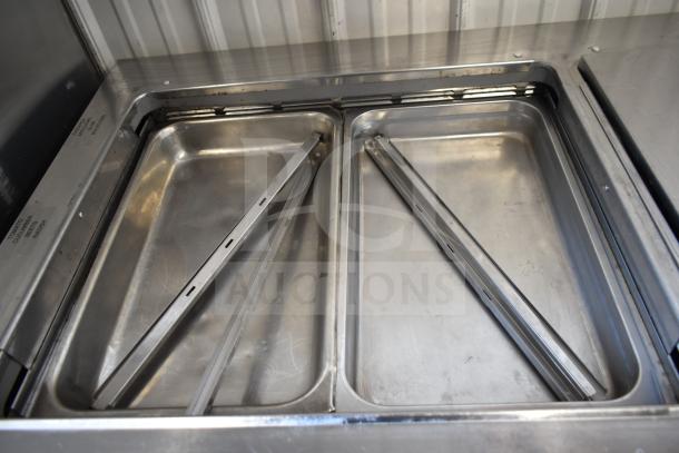 2020 Delfield D4460NP-24M-A5 prep table with 4 drawers, commercial casters, and stainless steel interior. 115V, 1 Phase.