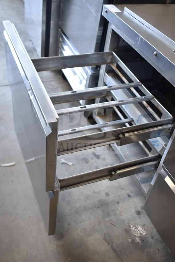 2020 Delfield D4460NP-24M-A5 prep table with 4 drawers, commercial casters, stainless steel, 115V, 1 phase.