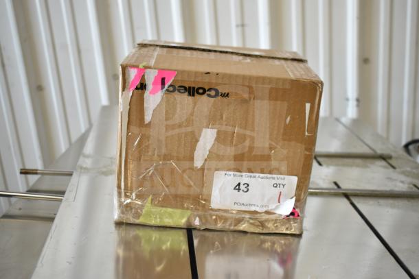 Box labeled as containing a C-Print2 MCP20 WT US Receipt Printer, showing signs of wear, with taped edges and auction stickers.