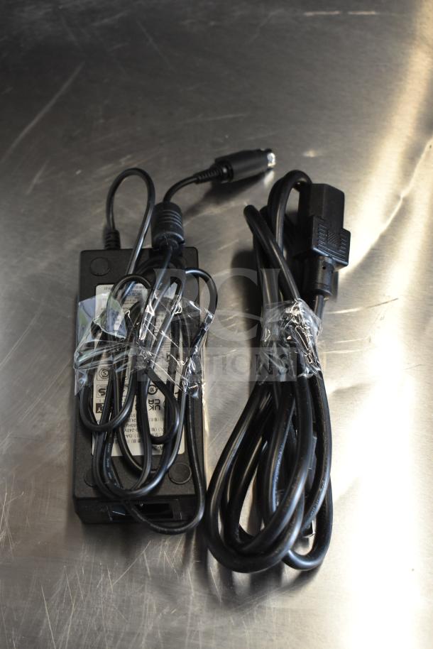 Power cables and adapter for C-Print2 MCP20 WT US Receipt Printer, bundled and wrapped with tape.