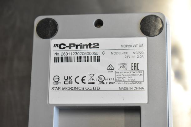 C-Print2 MCP20 WT US receipt printer label with model MCP20, 24V, 2.0A specifications, and made in China.