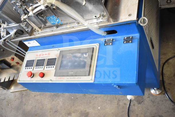 Commercial floor style paper tube labeling machine with digital control panel, commercial casters, and 208/240V, 1 phase power.