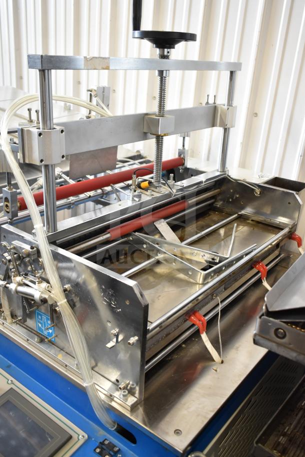 Commercial floor-style paper tube labeling machine on commercial casters, 208/240V, 1 phase, shown in operational condition.