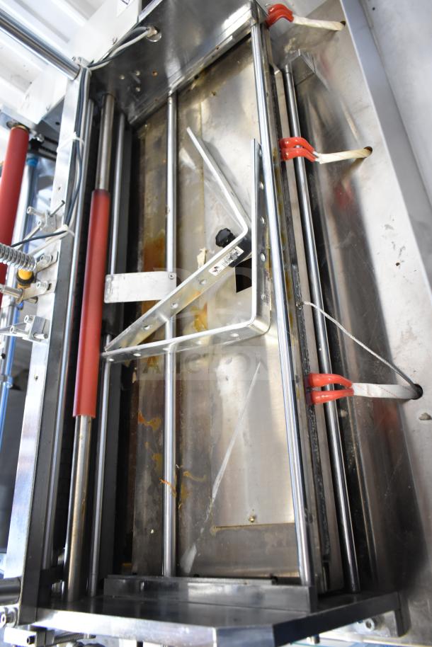 Commercial floor-style paper tube labeling machine on casters, 208/240V, 1-phase, metal frame, visible wear marks.