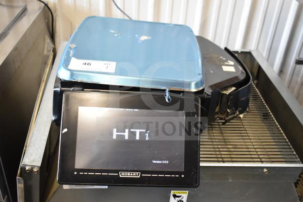 2018 Hobart HTi-7LH26 commercial countertop scale, tested and working, visible wear on surface, label showing auction info.