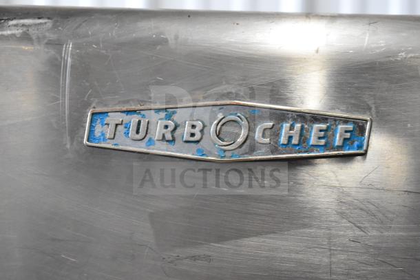 Turbochef HhC2020 logo on stainless steel surface, showcasing wear, indicative of a 2016 commercial conveyor oven.