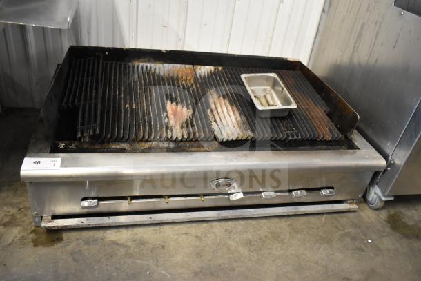 Wells Commercial Countertop Gas Charbroiler Grill in used condition. Features adjustable burners and comes with a drip tray.