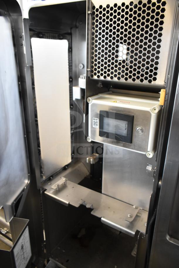 LATE MODEL JBT 2ND-GEN-MFJ-HE commercial citrus juicer, floor style, 115V, 1 phase, on casters, internal view, excellent condition.