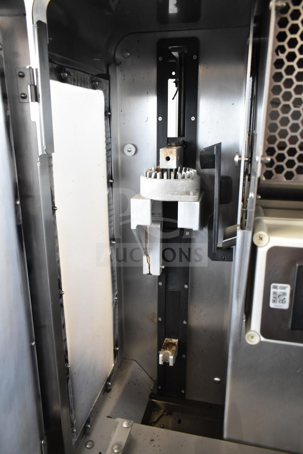 LATE MODEL JBT 2ND-GEN-MFJ-HE citrus juicer in stainless steel. Appears in used condition, built for commercial use.