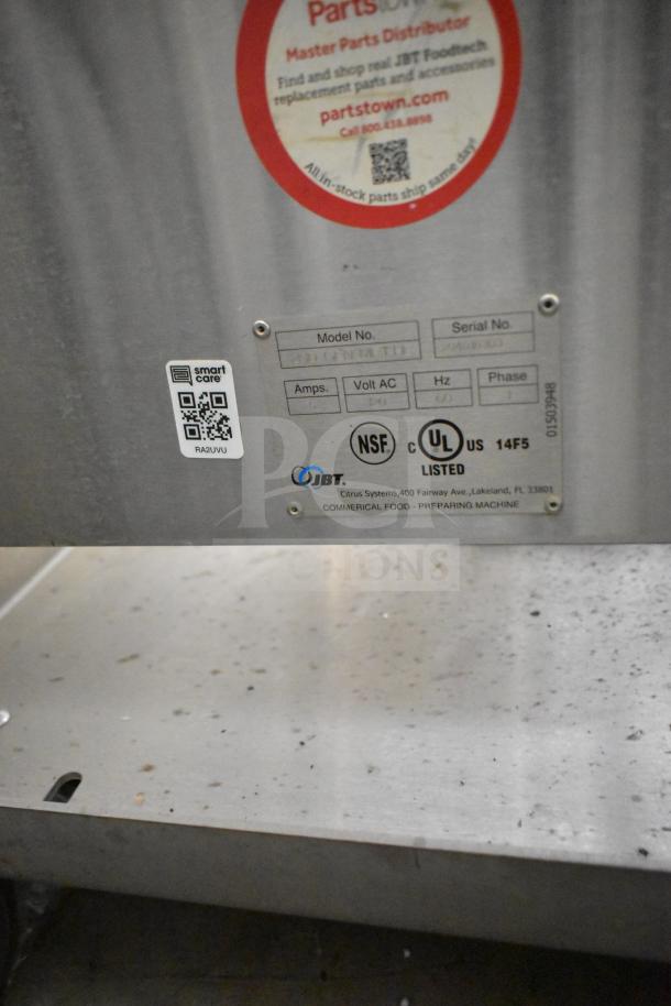 LATE MODEL JBT 2ND-GEN-MFJ-HE commercial citrus juicer on casters, NSF and UL listed. Serial and model label visible.