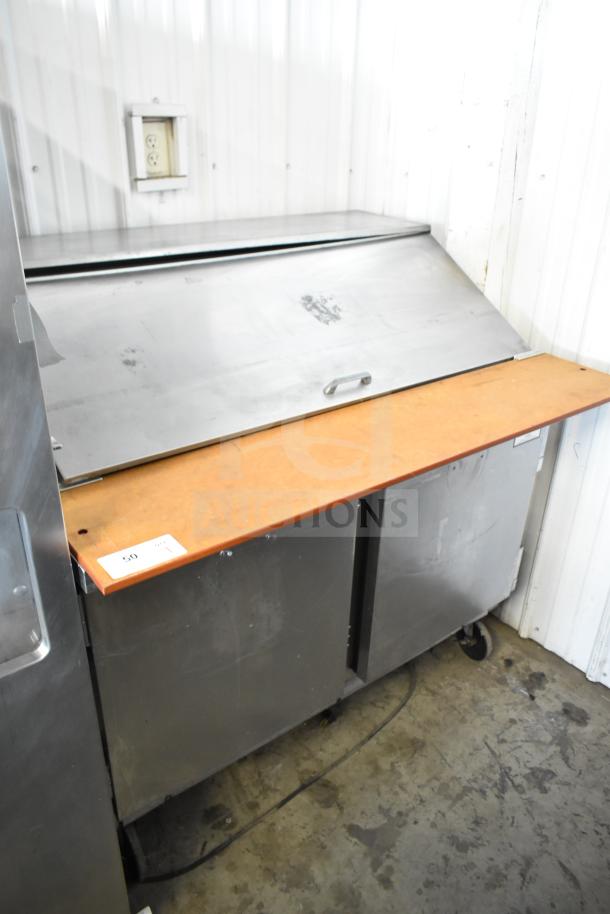 Beverage Air commercial sandwich salad prep table with mega top, stainless steel, on commercial casters, 115 volts, good condition.