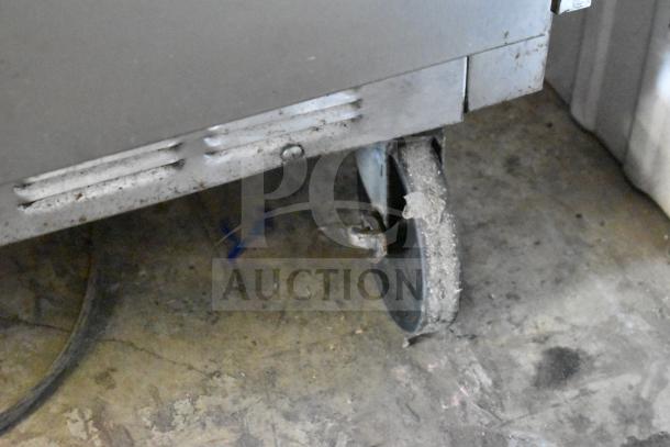 Beverage Air commercial prep table wheel and base, showing wear. Features mega top and commercial casters. 115V, 1 phase.