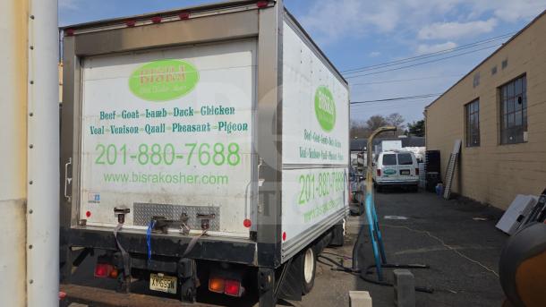 UD International Reefer Box Truck, white, used for meat transport, features Bisra Kosher branding and contact details.