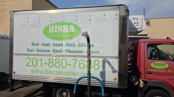 UD International Reefer Box Truck with "BISRA Glatt Kosher Meats" branding, located in Hackensack, NJ.