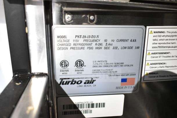 Turbo Air PST-28-12-D2-N prep table label showing electrical and refrigerant specifications, ETL certification, and warnings.