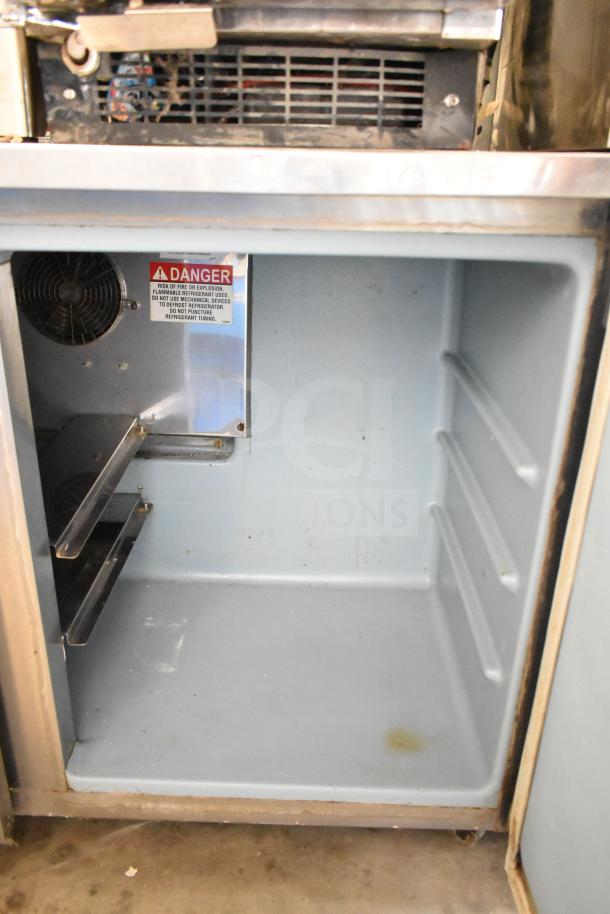 2016 Delfield UC4048P-STAR 2 Door Undercounter Cooler, 115V, 1 Phase, with some interior wear and a visible warning label.