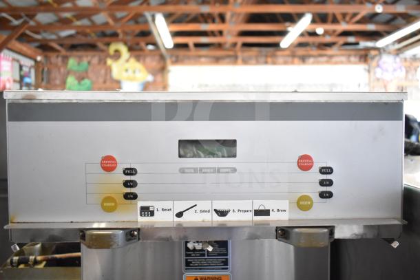 Bunn DUAL SH DBC commercial double coffee machine with hot water dispenser, featuring digital control panel and visible operation labels.