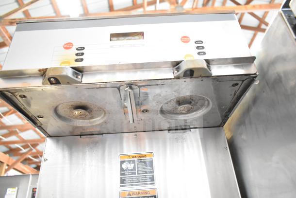 Bunn DUAL SH DBC commercial coffee machine with hot water dispenser. Features control panel and warning labels.