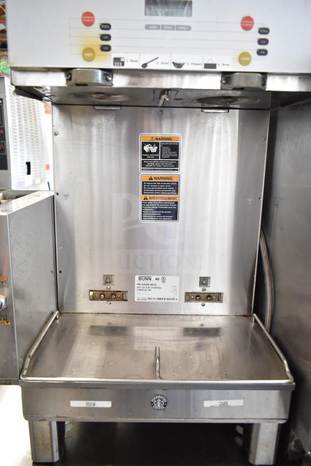 Bunn DUAL SH DBC Commercial Coffee Machine with hot water dispenser, 120/208V, stainless steel, good condition, warning labels visible.
