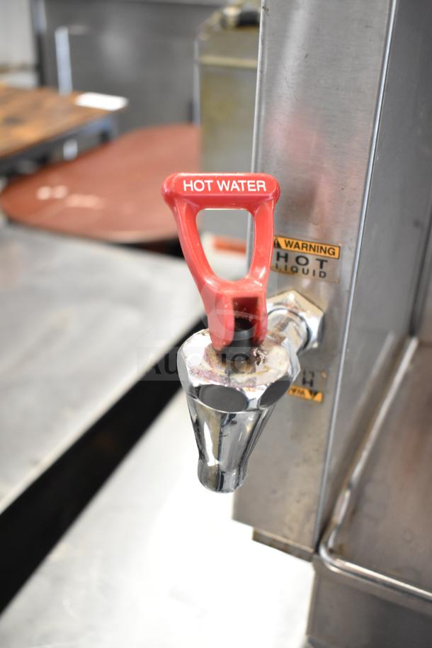 Bunn DUAL SH DBC coffee machine with hot water dispenser, 120/208V, 1 Phase. Features "HOT WATER" handle and warning label.