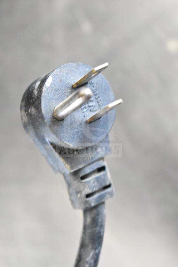 Close-up of a power plug labeled 115 Volts, used for the Delfield 406-STAR2 commercial undercounter cooler.