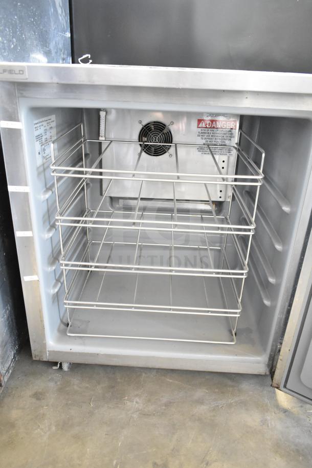 2021 Delfield 406P-STAR2 undercounter cooler, single door, open view. 115V, 1 phase. Clean interior, wire shelves, caution label visible.