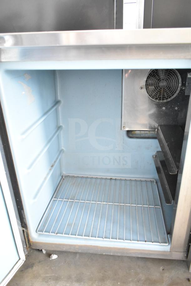 Delfield Commercial 2 Door Undercounter Cooler, 115 Volts, 1 Phase. Interior view, wire shelf, used condition.