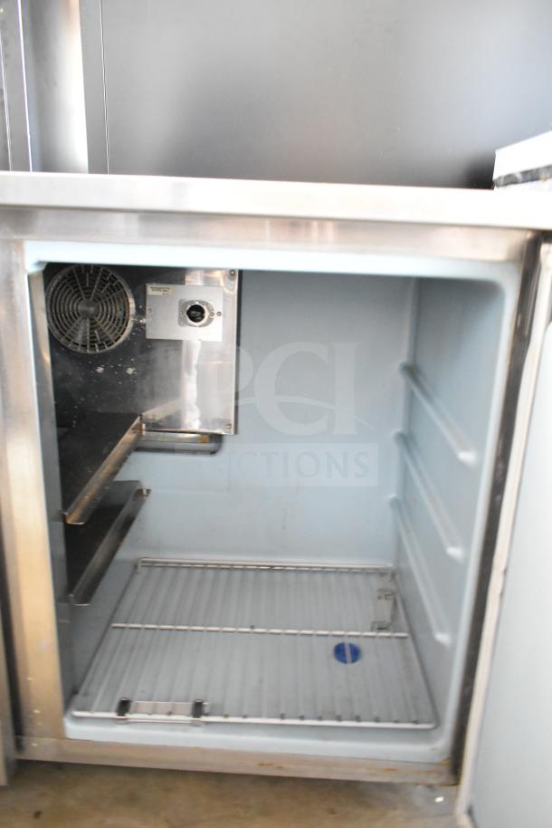Delfield Commercial 2 Door Undercounter Cooler, 115V, 1 Phase, stainless steel interior, visible shelving, fan unit.