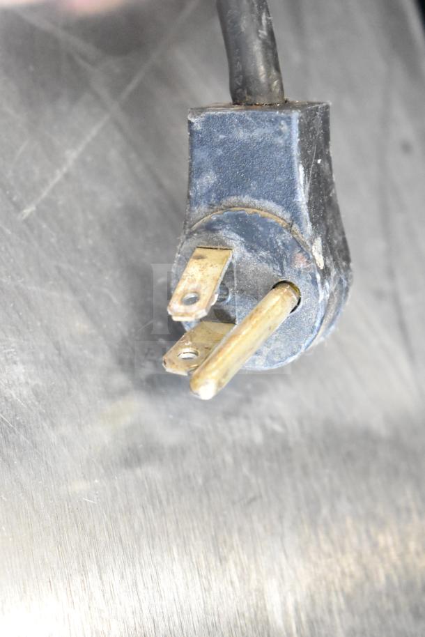 Delfield Commercial Cooler power plug, showing three-pronged design for 115 volts, 1 phase. Plug appears in used condition.