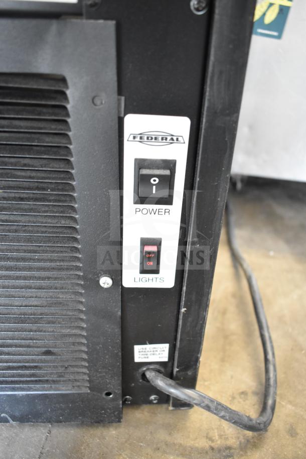 Federal Industries SSRVS3633 refrigerated counter case control panel with power and lights switches visible.