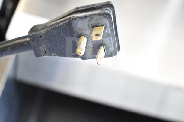 Close-up of a power plug for Federal Industries SSRVS3633 refrigerated self-serve counter, 120 Volts, 1 Phase.