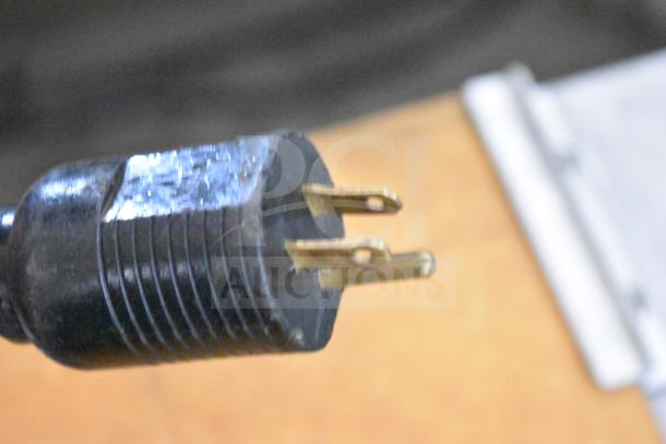 Close-up of the plug for a JBT 2ND-GEN-MFJ-HE Fresh N Squeeze Citrus Juicer, showing standard three-prong design.